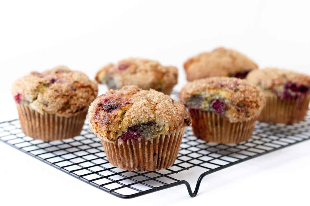 raspberry teff muffins on rack