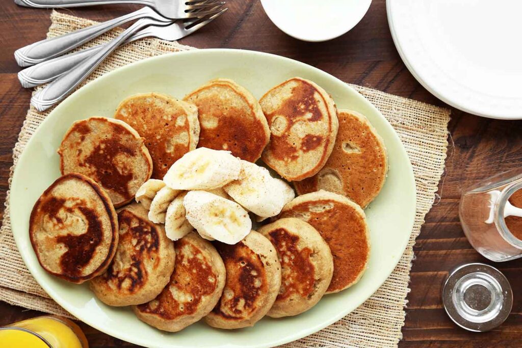 Gluten-Free pancakes on a plate with banana slices