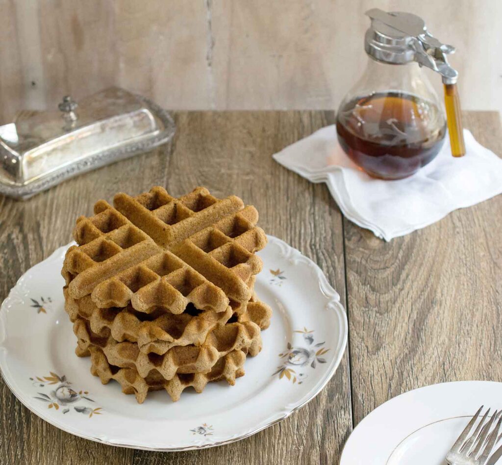 stack of chai spiced gluten-free waffles stacked on plate