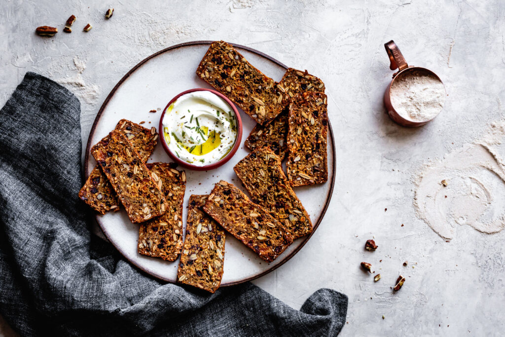 Rosemary Nut Crackers on plate with dip