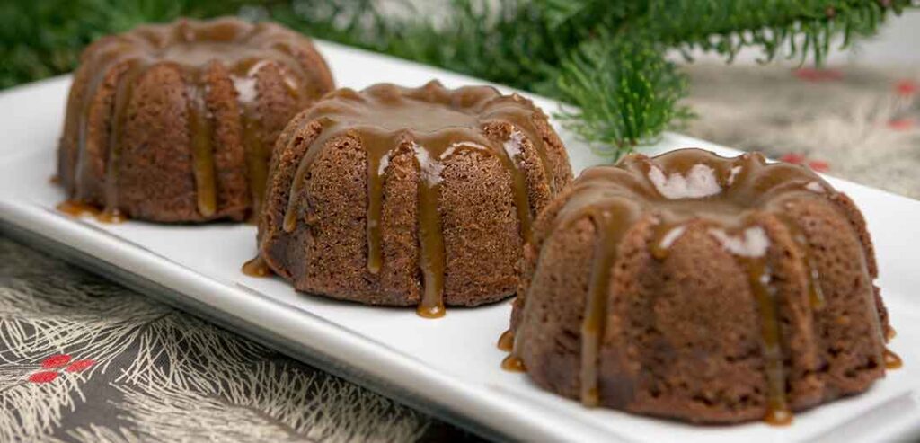 Three Sticky Toffee Puddings on a plate