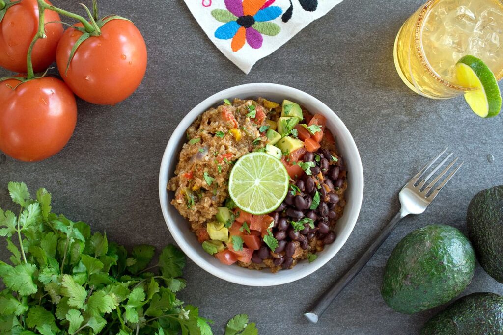 Southwest Teff and Steel Cut Oats in bowl surrounded by fresh ingredients