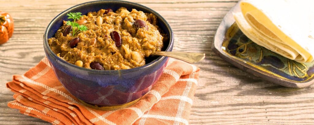 Gluten-Free & Vegan Slow Cooker Chili in a ceramic blue bowl