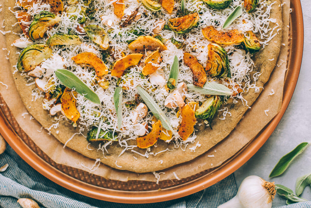 Beautiful Teff homemade pizza topped with fresh vegetables
