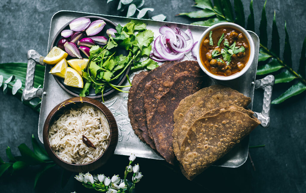 Gluten-Free Teff Roti displayed on tray with fresh ingredients