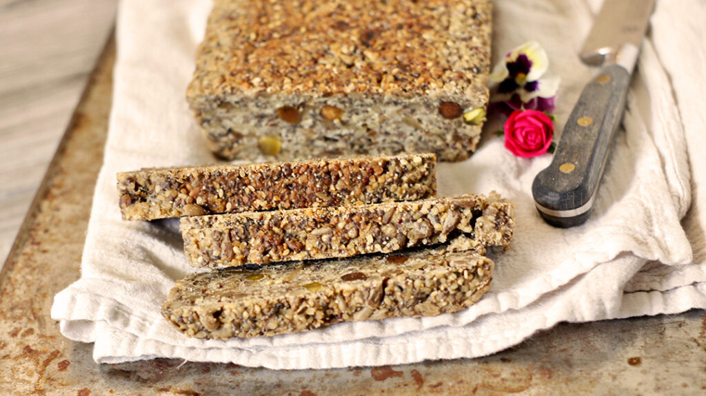 Teff Seed Bread displayed with cutting knife