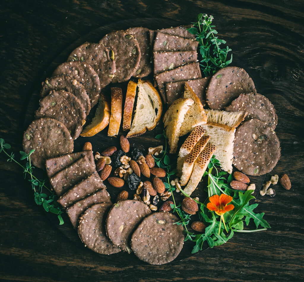 Charcuterie spread with Seeded Teff Crackers and nuts