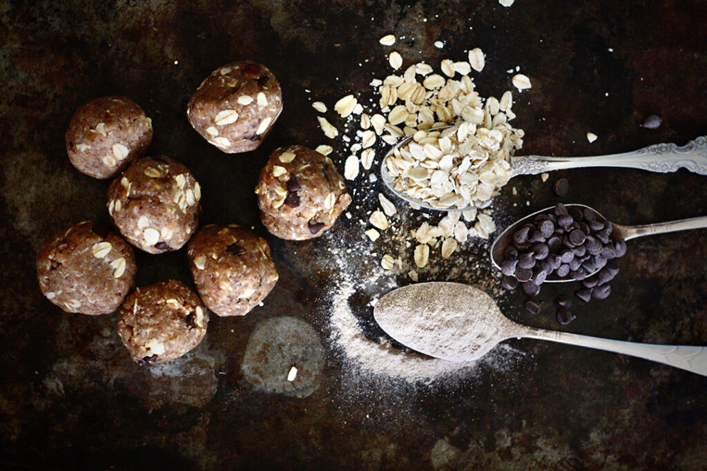 Vegan and gluten free chocolate chip cookie dough energy bites displayed on counter top