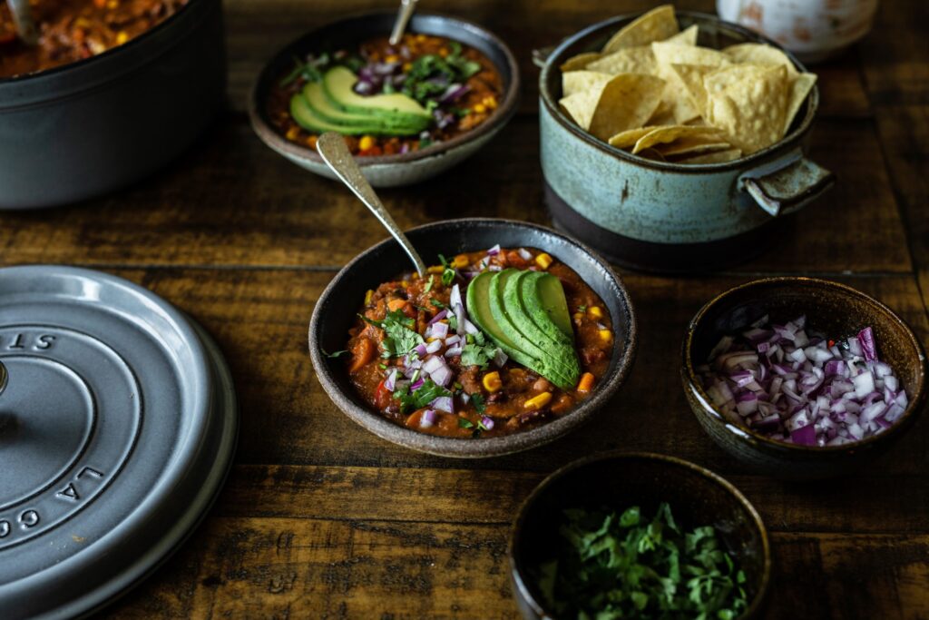 Vegan Mexican Chili in bowls with sliced avocado on top