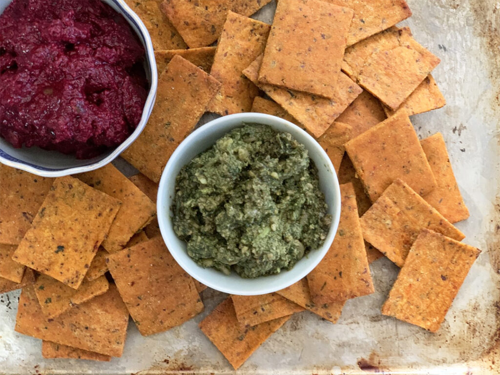 Gluten-Free Pizza Crackers on trey with red and green dips