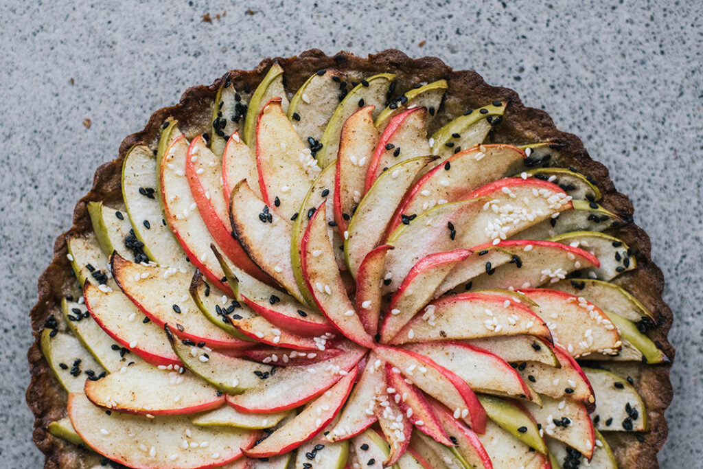 Tahini Apple Tart with Teff Crust displayed on counter