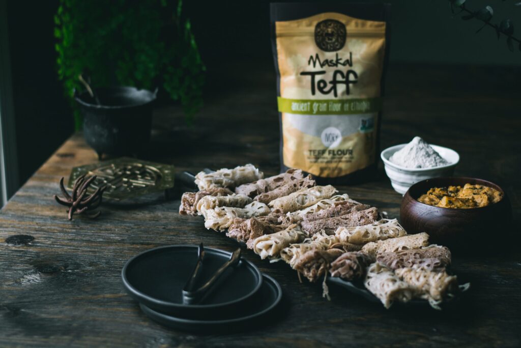 Vegan Teff Roti Jala displayed on table with maskal teff packaging