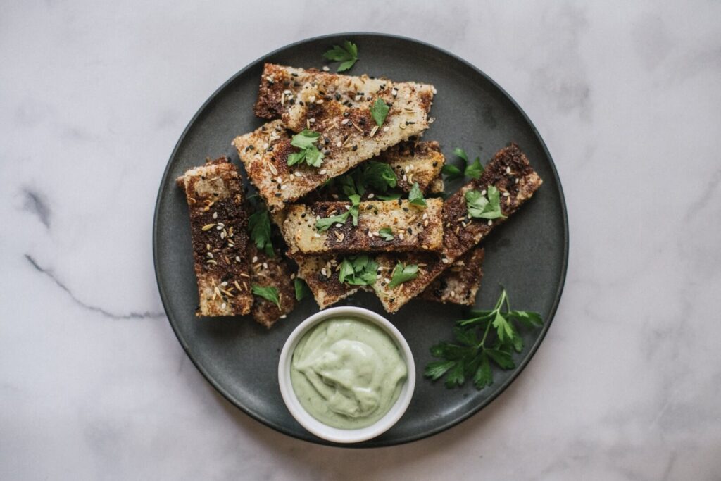 Seeded Polenta Teff Fries on plate with dip