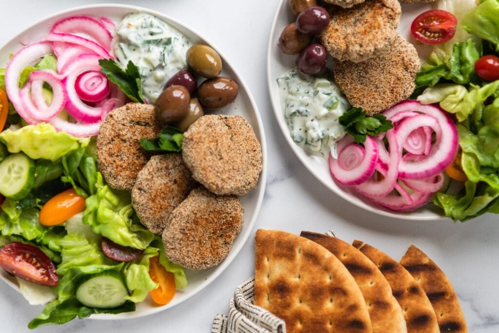 Turkey Kofta meals with vegitables on plates