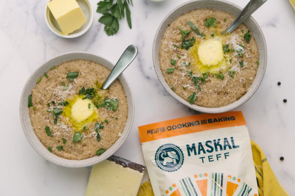 Gluten-Free Cheesy Pepper Teff Grits in bowl with melting butter