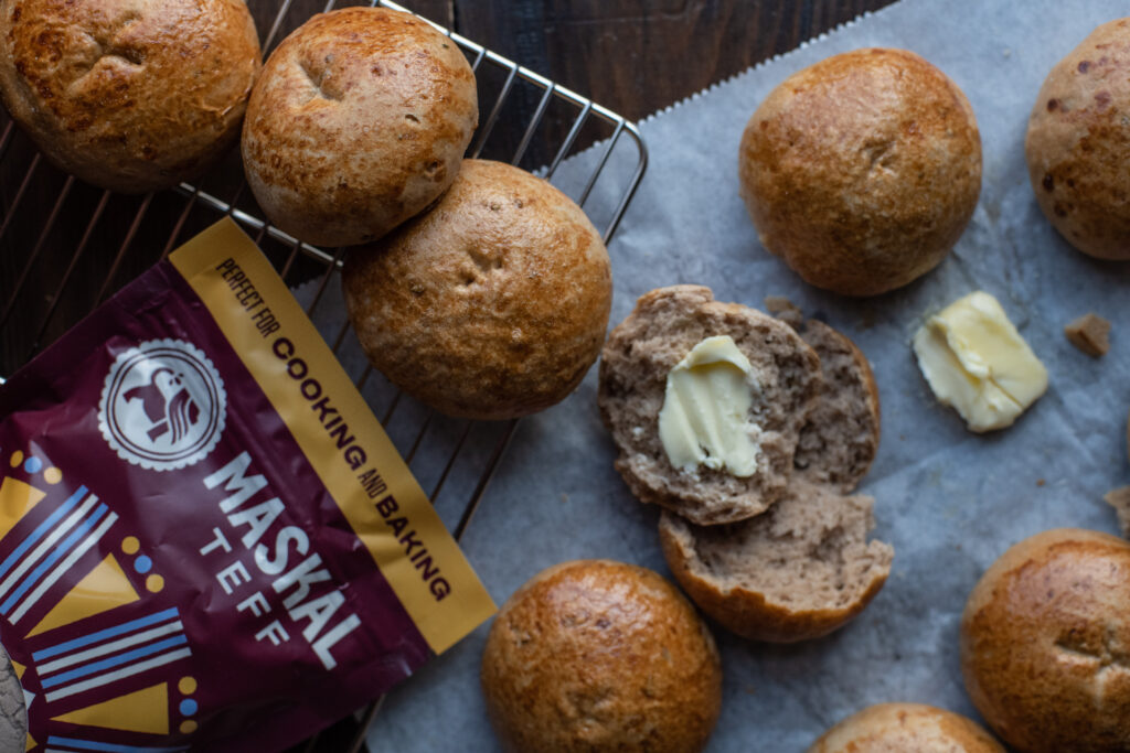 Rosemary and Honey Maskal Teff Dinner Rolls with butter